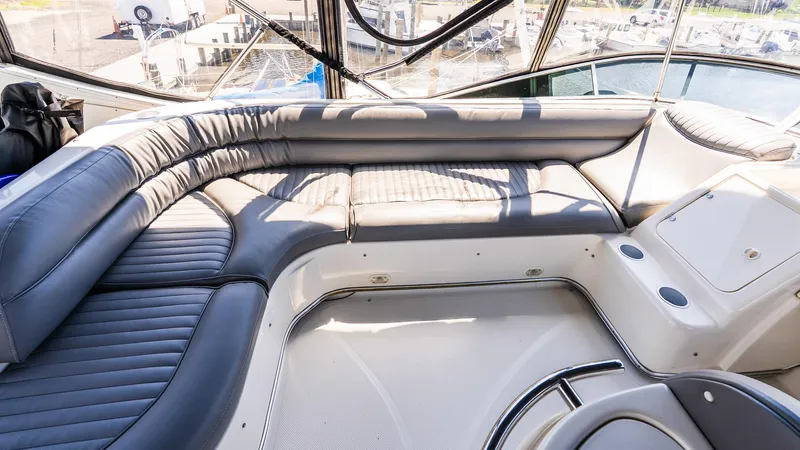 Knot On Call II Yacht Photos Pics Luxurious seating area on a 2000 Maxum 4600 SCB yacht, featuring sleek design and waterfront view.