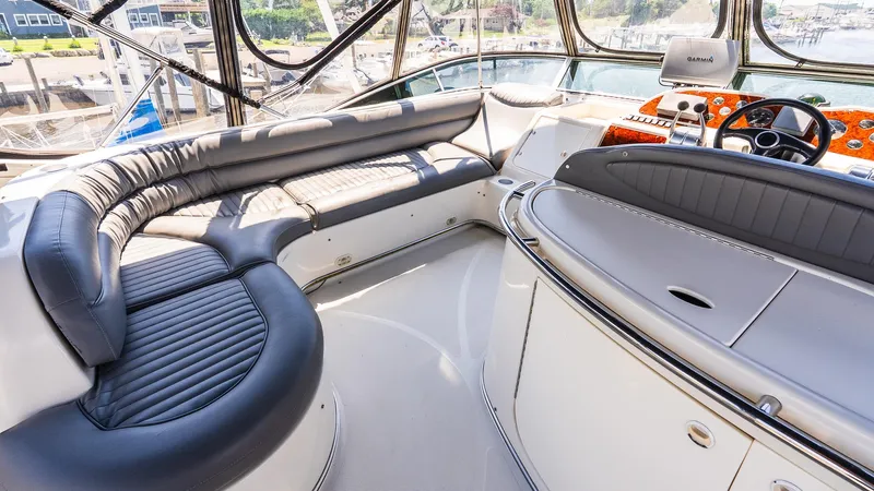 Knot On Call II Yacht Photos Pics Luxurious interior of 2000 Maxum 4600 SCB yacht with plush seating and modern controls.