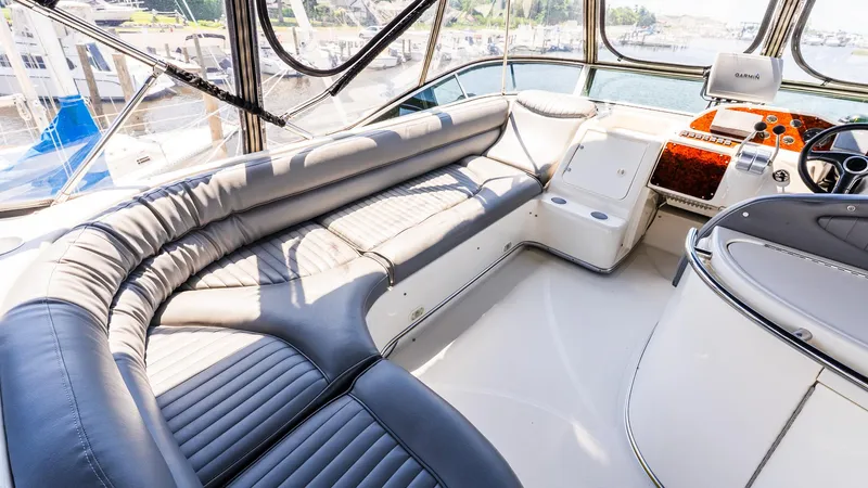Knot On Call II Yacht Photos Pics Luxurious interior of 2000 Maxum 4600 SCB yacht with plush seating and modern controls.