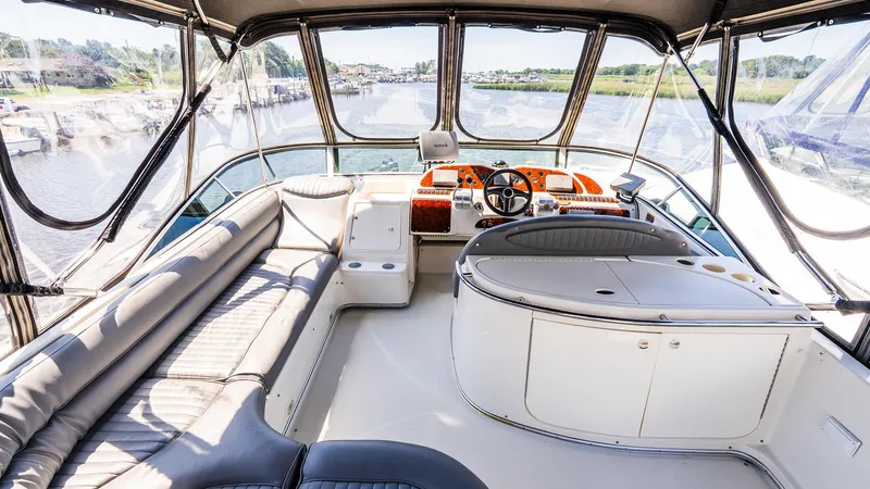 Knot On Call II Yacht Photos Pics Luxurious interior of 2000 Maxum 4600 SCB yacht with spacious seating and helm.