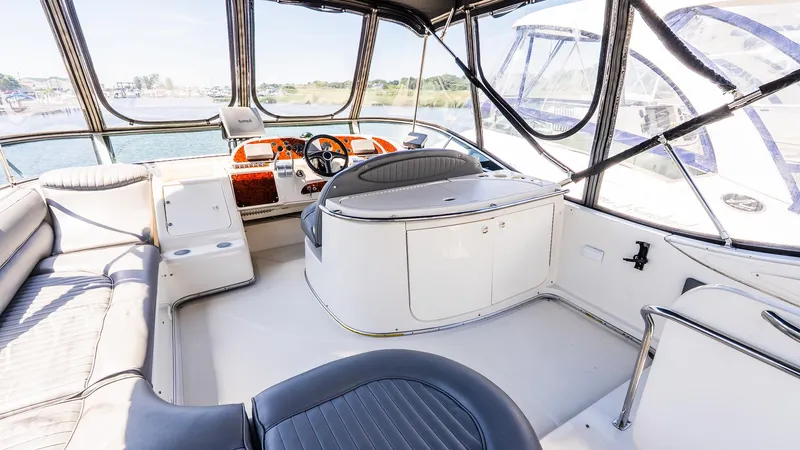 Knot On Call II Yacht Photos Pics Interior view of 2000 Maxum 4600 SCB yacht with spacious seating and helm.