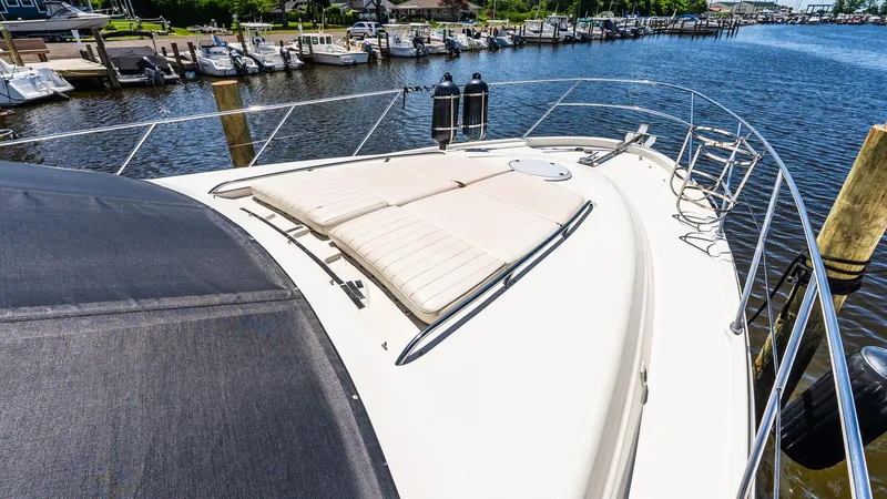 Knot On Call II Yacht Photos Pics 2000 Maxum 4600 SCB yacht with sunbathing deck, docked at marina.