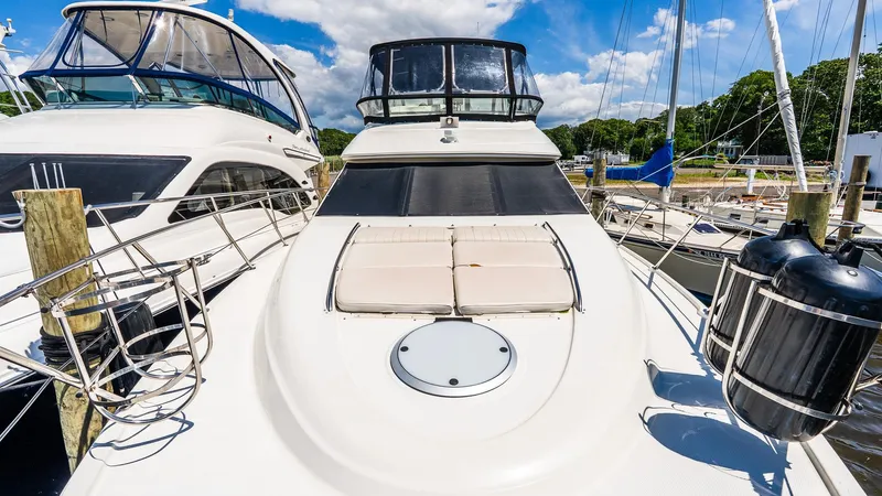 Knot On Call II Yacht Photos Pics 2000 Maxum 4600 SCB yacht docked at marina, featuring sleek design and spacious deck.