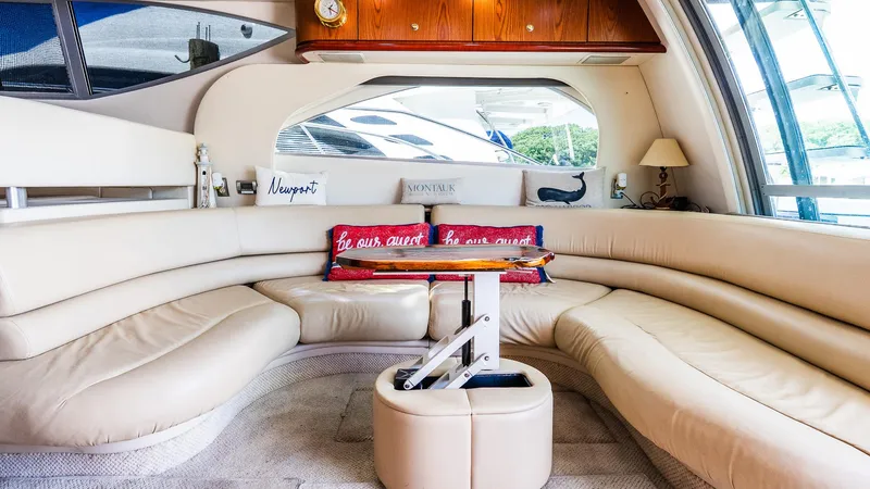 Knot On Call II Yacht Photos Pics Luxurious interior of 2000 Maxum 4600 SCB yacht with plush seating and elegant decor.