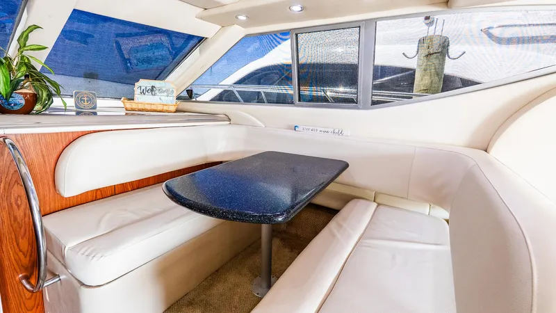 Knot On Call II Yacht Photos Pics Interior of 2000 Maxum 4600 SCB yacht with cozy dining area and elegant seating.