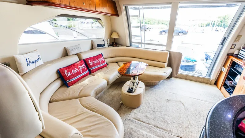 Knot On Call II Yacht Photos Pics Luxurious interior of 2000 Maxum 4600 SCB yacht with plush seating and elegant decor.