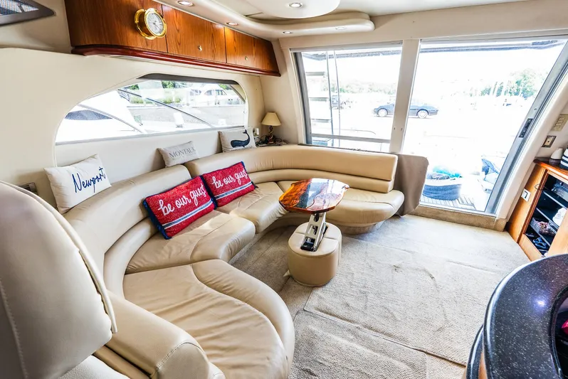 Knot On Call II Yacht Photos Pics Luxurious interior of 2000 Maxum 4600 SCB yacht with plush seating and decorative pillows.