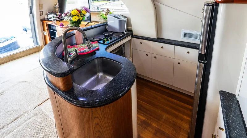 Knot On Call II Yacht Photos Pics Luxurious kitchen interior of 2000 Maxum 4600 SCB yacht with modern amenities.