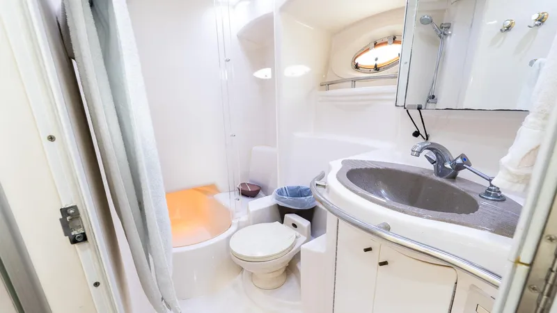 Knot On Call II Yacht Photos Pics Bathroom interior of 2000 Maxum 4600 SCB yacht with sink, toilet, and shower.