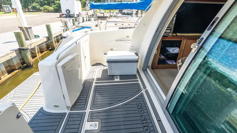 Knot On Call II Yacht Photos Pics 2000 Maxum 4600 SCB yacht deck with seating, docked at marina.