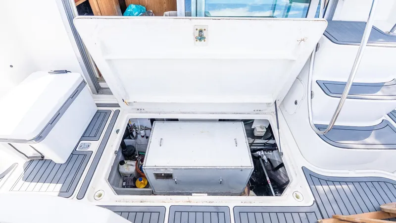 Knot On Call II Yacht Photos Pics Open engine compartment of 2000 Maxum 4600 SCB yacht, showcasing mechanical components.