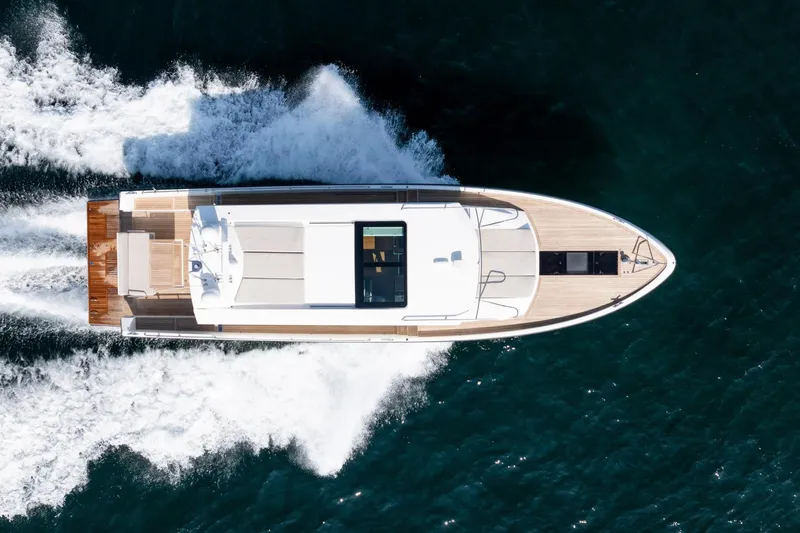  Yacht Photos Pics Aerial view of 2017 Delta Powerboats 54 IPS cruising on open water.