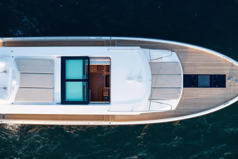  Yacht Photos Pics Top view of 2017 Delta Powerboats 54 IPS yacht on water.