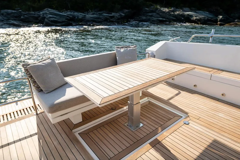  Yacht Photos Pics Luxurious 2017 Delta Powerboats 54 IPS yacht deck with elegant seating and table.