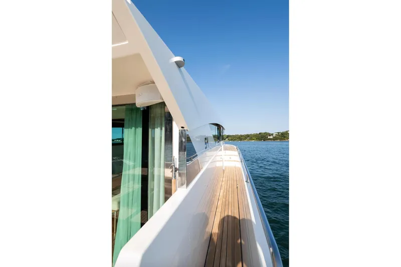  Yacht Photos Pics Side view of 2017 Delta Powerboats 54 IPS yacht on calm water.