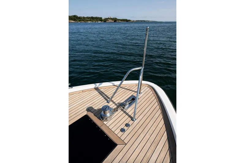  Yacht Photos Pics Bow view of 2017 Delta Powerboats 54 IPS on calm water.