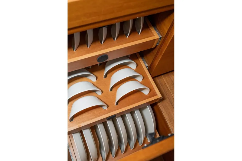  Yacht Photos Pics Wooden drawer with organized white plates on Delta Powerboats 54 IPS, 2017 model.