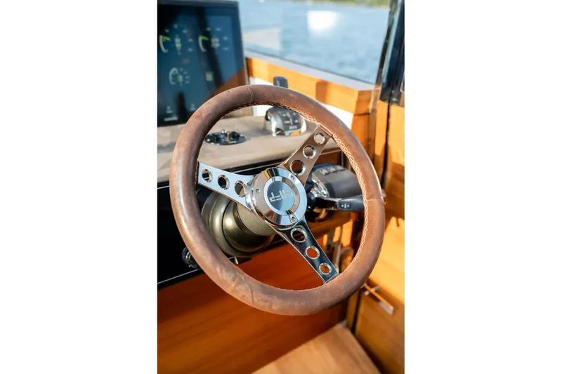  Yacht Photos Pics Steering wheel of 2017 Delta Powerboats 54 IPS, featuring a classic design and modern controls.