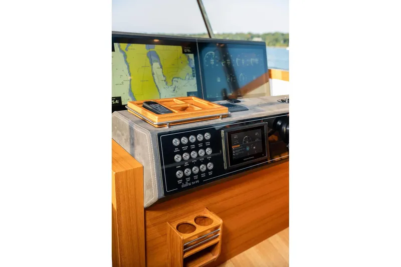  Yacht Photos Pics Cockpit of 2017 Delta Powerboats 54 IPS with navigation screens and control panel.