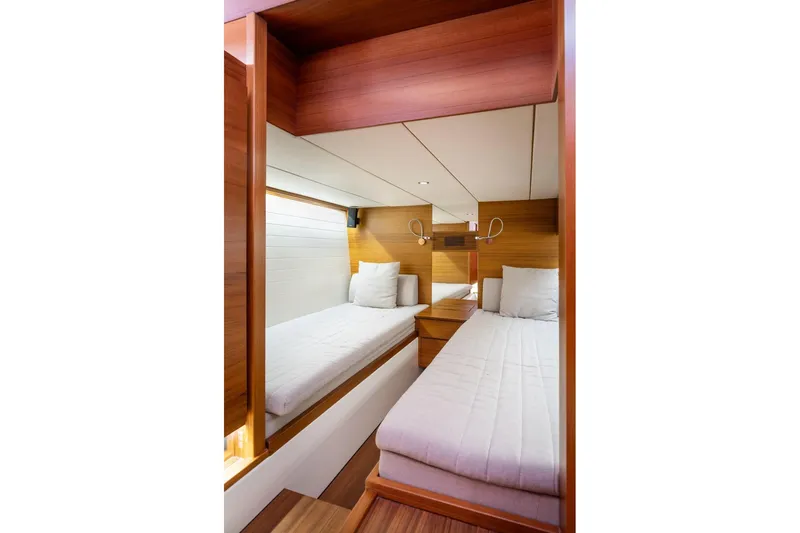  Yacht Photos Pics Interior of 2017 Delta Powerboats 54 IPS, featuring twin beds and wooden finishes.