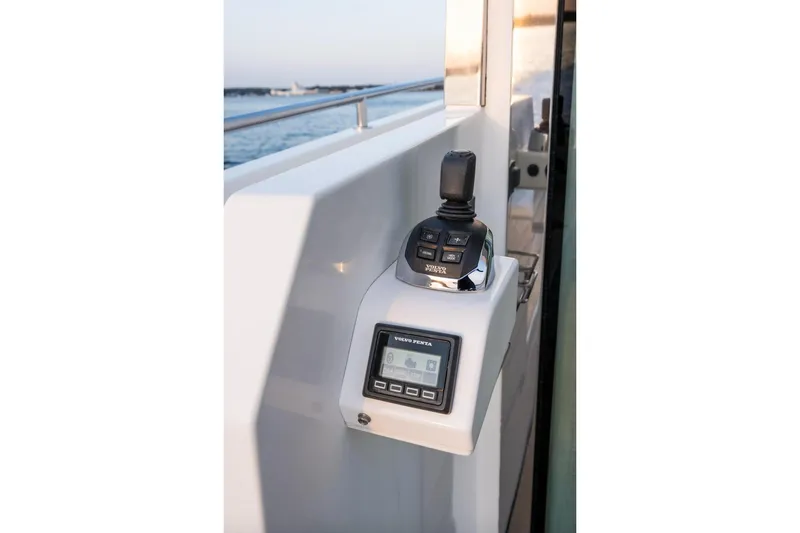  Yacht Photos Pics Control panel of 2017 Delta Powerboats 54 IPS, featuring joystick and display.