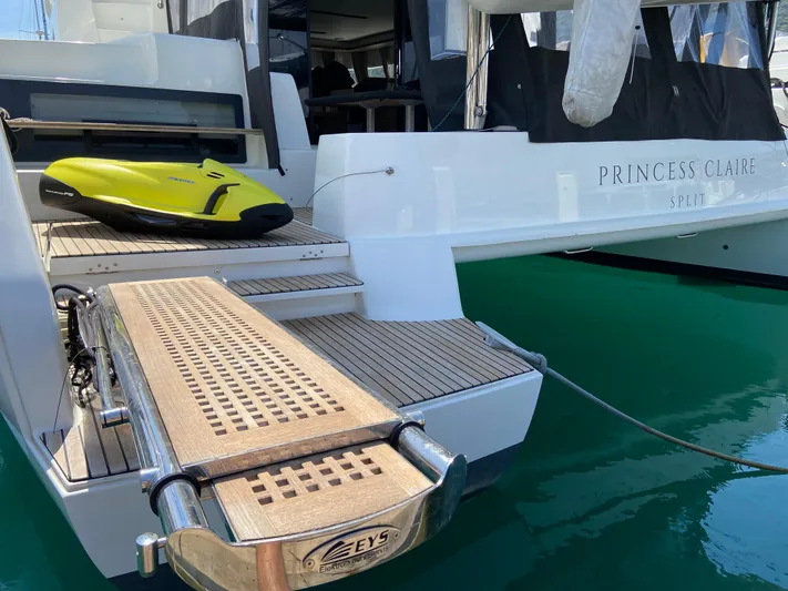 Yacht Photos Pics Lagoon 50 catamaran, 2019 model, with a swim platform and water scooter on deck.