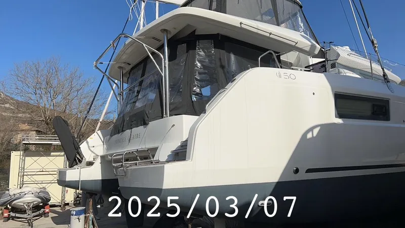  Yacht Photos Pics 2019 Lagoon 50 catamaran docked, rear view, sunny day, date overlay 2025/03/07.