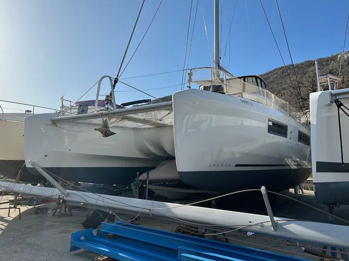  Yacht Photos Pics 2019 Lagoon 50 catamaran on land, showcasing sleek design and modern features.