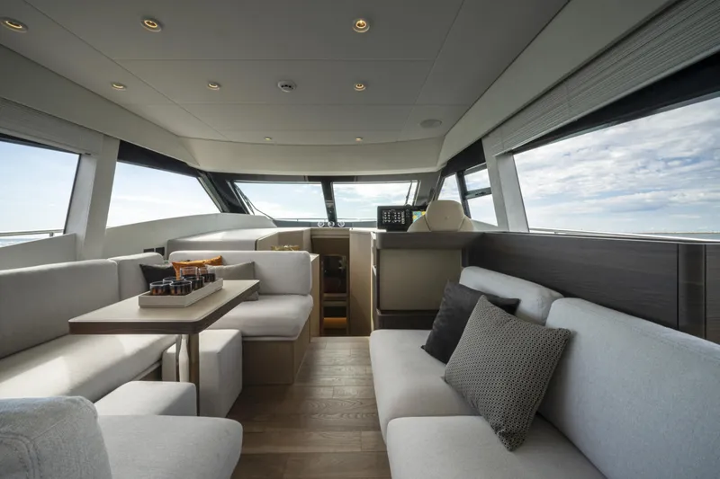  Yacht Photos Pics Luxurious interior of 2023 Ferretti Yachts 500 with modern seating and panoramic windows.