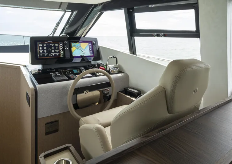  Yacht Photos Pics 2023 Ferretti Yachts 500 helm with modern navigation displays and luxurious seating.