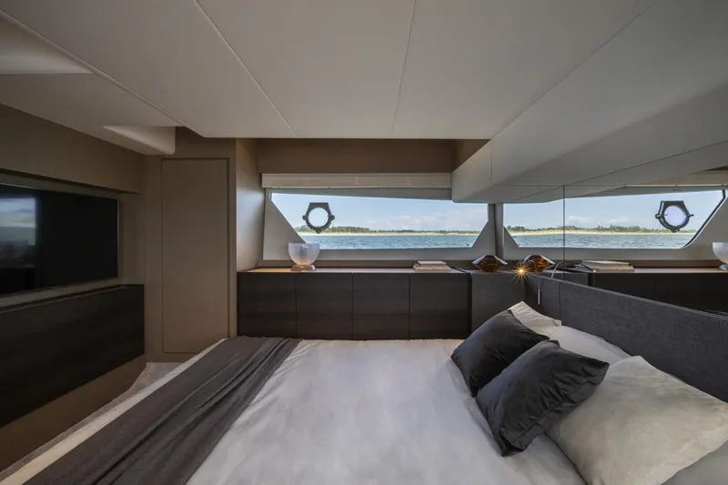  Yacht Photos Pics Luxurious bedroom interior of 2023 Ferretti Yachts 500 with scenic ocean view.