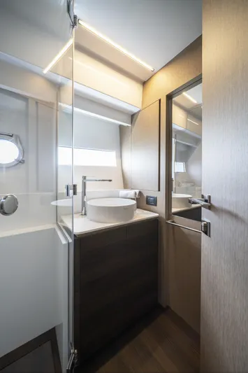  Yacht Photos Pics 2023 Ferretti Yachts 500 bathroom with modern design, glass shower, and sleek fixtures.