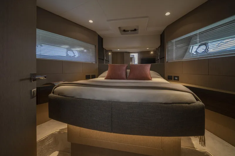  Yacht Photos Pics Luxurious bedroom interior of 2023 Ferretti Yachts 500 with modern design and cozy ambiance.