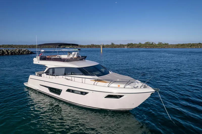  Yacht Photos Pics 2023 Ferretti Yachts 500 cruising on calm blue waters under clear skies.