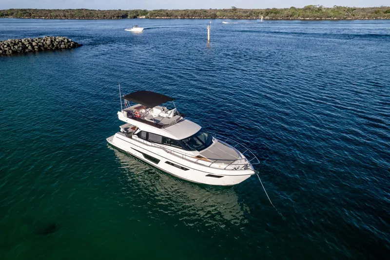  Yacht Photos Pics 2023 Ferretti Yachts 500 cruising on calm blue waters.