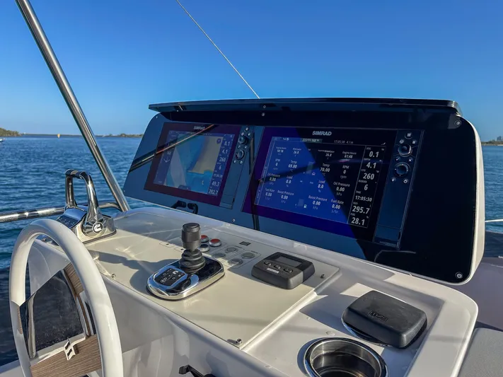  Yacht Photos Pics Helm of 2023 Ferretti Yachts 500 with advanced navigation displays and controls.