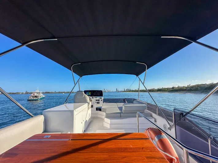  Yacht Photos Pics 2023 Ferretti Yachts 500, spacious deck view, cruising on calm waters under clear blue sky.