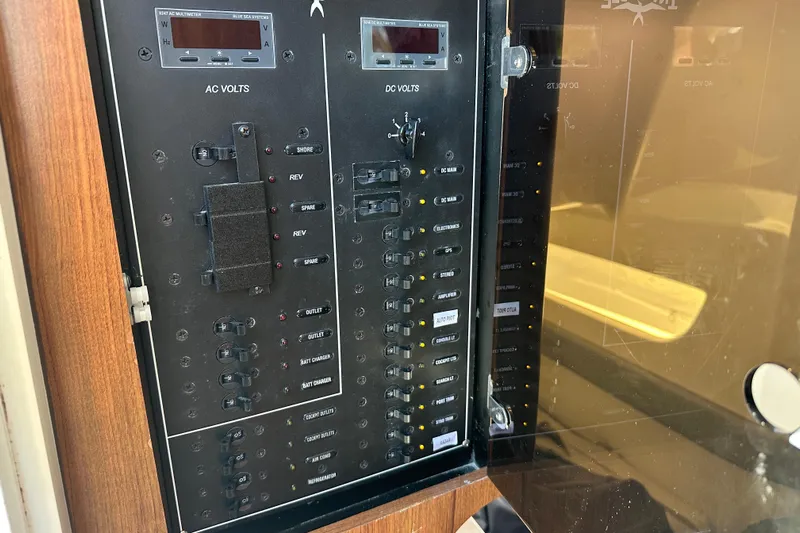  Yacht Photos Pics Electrical panel on Invincible 42 boat, 2018 model, showing AC and DC volt meters.