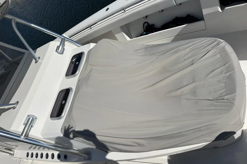  Yacht Photos Pics Covered seating area on 2018 Invincible 42 boat, with stainless steel railings.