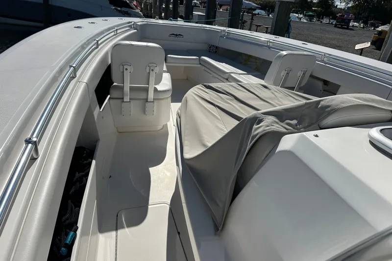 Yacht Photos Pics 2018 Invincible 42 boat interior with seating and covered console.
