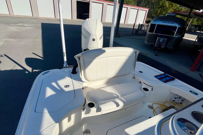  Yacht Photos Pics 2018 SeaVee 270Z boat with Mercury engine, featuring white seating and storage compartments.