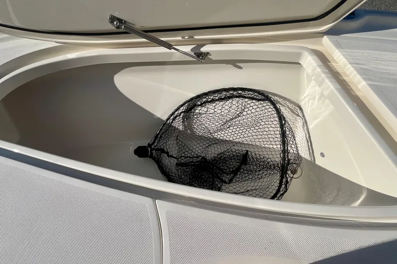  Yacht Photos Pics Open storage compartment on 2018 SeaVee 270Z boat with a fishing net inside.
