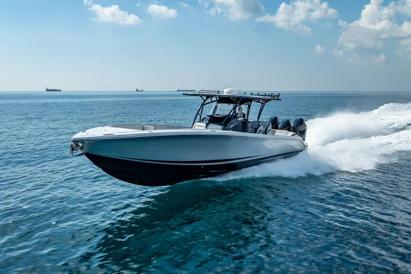  Yacht Photos Pics 2024 Nor-Tech 390 Sport Center Console speeding on open water.