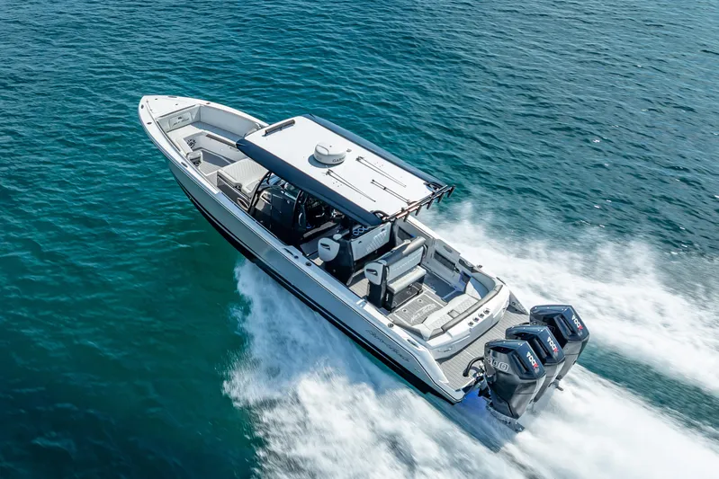  Yacht Photos Pics 2024 Nor-Tech 390 Sport Center Console boat cruising on open water.