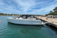 2015 Fjord 40 Open yacht docked at a marina under a clear blue sky.