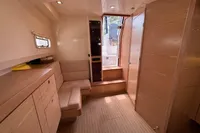 Interior of 2015 Fjord 40 Open yacht with wooden cabinetry and seating.