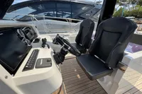 Helm of 2015 Fjord 40 Open yacht with dual seats and modern controls.