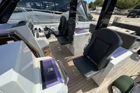 2015 Fjord 40 Open yacht cockpit with modern seating and control panel.