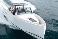 2015 Fjord 40 Open yacht cruising on the ocean with passengers onboard.