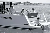 A group enjoying leisure time on a 2015 Fjord 40 Open yacht.